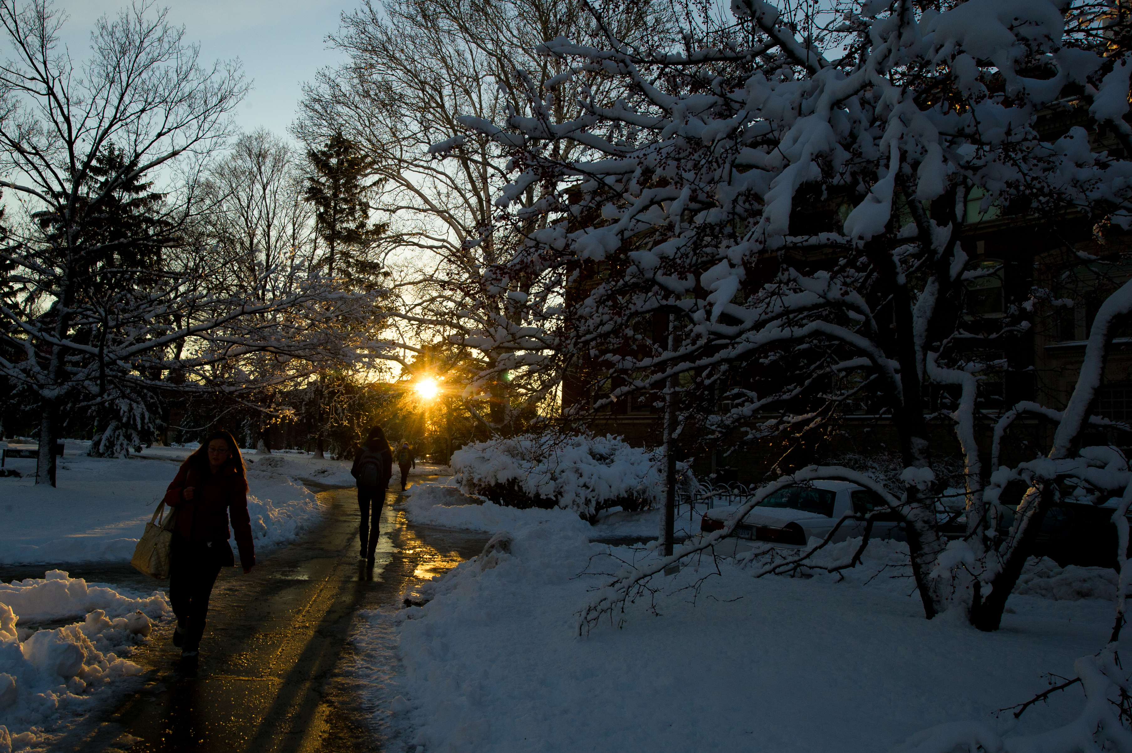 Students trekking through North Neighborhood over paths cleared by MSU IPF.